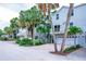 Row of beach homes with tropical landscaping and private driveways at 6250 Holmes Blvd # 32, Holmes Beach, FL 34217