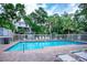 Inviting community pool with lounge chairs and umbrellas at 6250 Holmes Blvd # 32, Holmes Beach, FL 34217