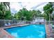 Relaxing community pool area with surrounding greenery at 6250 Holmes Blvd # 32, Holmes Beach, FL 34217