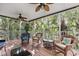 This screened porch offers a relaxing space to enjoy the outdoors at 6250 Holmes Blvd # 32, Holmes Beach, FL 34217
