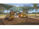 A colorful covered playground including slides and climbing features is a fun place to spend the day at 6305 Royal Tern Cir, Lakewood Ranch, FL 34202