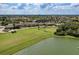 Aerial view of community, showcasing the golf course and clubhouse at 7005 River Hammock Dr # 103, Bradenton, FL 34212