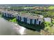 Aerial view of condo building by the lake at 7005 River Hammock Dr # 103, Bradenton, FL 34212