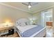 Bedroom with a queen bed, nightstand, and built in desk at 7005 River Hammock Dr # 103, Bradenton, FL 34212