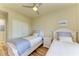 Twin bedroom with two beds and closet at 7005 River Hammock Dr # 103, Bradenton, FL 34212