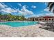 Relaxing pool area with plenty of lounge chairs at 7005 River Hammock Dr # 103, Bradenton, FL 34212