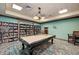 Game room with pool table and extensive library at 7005 River Hammock Dr # 103, Bradenton, FL 34212