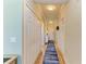 Condo hallway with light walls and wood floors at 7005 River Hammock Dr # 103, Bradenton, FL 34212
