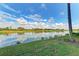 Serene view of lake and lush green landscape at 7005 River Hammock Dr # 103, Bradenton, FL 34212