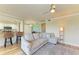 Relaxing living room with sectional sofa, hardwood floors and ceiling fan at 7005 River Hammock Dr # 103, Bradenton, FL 34212