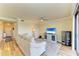 Spacious living room with light beige sectional sofa and hardwood floors at 7005 River Hammock Dr # 103, Bradenton, FL 34212