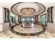 Elegant lobby with high ceilings and circular seating area at 7005 River Hammock Dr # 103, Bradenton, FL 34212