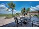 Relaxing patio with outdoor seating overlooking a golf course at 7005 River Hammock Dr # 103, Bradenton, FL 34212