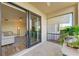 Screened patio with sliding glass doors to living room at 7005 River Hammock Dr # 103, Bradenton, FL 34212