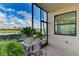 Peaceful screened patio overlooking lake and golf course at 7005 River Hammock Dr # 103, Bradenton, FL 34212