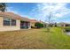 Backyard with screened patio overlooking a tranquil lake at 7416 Birds Eye Ter, Bradenton, FL 34203