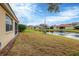 Backyard with pond view and screened-in patio at 7416 Birds Eye Ter, Bradenton, FL 34203