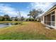 Spacious backyard with pond view and screened patio at 7416 Birds Eye Ter, Bradenton, FL 34203