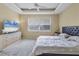 Primary bedroom with large window, comfortable bed, and dresser at 7416 Birds Eye Ter, Bradenton, FL 34203