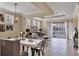 Bright dining area with seating for four and access to the living room at 7416 Birds Eye Ter, Bradenton, FL 34203