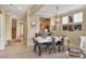 Open concept dining room with a farmhouse table and metal chairs at 7416 Birds Eye Ter, Bradenton, FL 34203