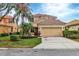 Beautiful two-story house with a two-car garage and lush landscaping at 7416 Birds Eye Ter, Bradenton, FL 34203