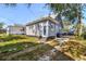 Rear view of house showcasing gray siding and landscaping at 766 13Th S Ave, St Petersburg, FL 33701