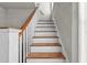 Simple wooden staircase with white railings at 766 13Th S Ave, St Petersburg, FL 33701