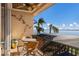 Relaxing balcony with water views and patio furniture at 805 Riviera Dunes Way, Palmetto, FL 34221