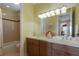 Elegant bathroom with double vanity and shower/tub combo at 805 Riviera Dunes Way, Palmetto, FL 34221