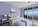 Stylish bedroom with a walkout balcony and a beautiful waterfront view at 805 Riviera Dunes Way, Palmetto, FL 34221