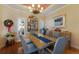 Formal dining room with hardwood floors and neutral decor at 805 Riviera Dunes Way, Palmetto, FL 34221