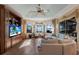 Gathering room with water views, hardwood floors and built-in entertainment center at 805 Riviera Dunes Way, Palmetto, FL 34221