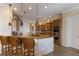 Gourmet kitchen with granite counters, kitchen island and stainless steel appliances at 805 Riviera Dunes Way, Palmetto, FL 34221