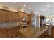 Gourmet kitchen with kitchen island and stainless steel appliances and plenty of counter space at 805 Riviera Dunes Way, Palmetto, FL 34221