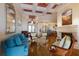 Inviting living room with hardwood floors, fireplace and comfortable furniture arrangement at 805 Riviera Dunes Way, Palmetto, FL 34221