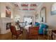 Bright living room with hardwood floors, fireplace, coffered ceilings and water view at 805 Riviera Dunes Way, Palmetto, FL 34221