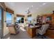 Home office with water views and built-in desk and shelving at 805 Riviera Dunes Way, Palmetto, FL 34221