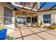 Large covered patio with multiple seating areas at 805 Riviera Dunes Way, Palmetto, FL 34221