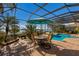 Enjoy dining and swimming with this poolside patio at 805 Riviera Dunes Way, Palmetto, FL 34221