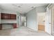 Bedroom with built-in desk and shelving, featuring a walk-in closet and access to another room at 8412 Whispering Woods Ct, Lakewood Ranch, FL 34202