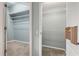 Walk-in closets featuring shelving and carpeted floors at 8412 Whispering Woods Ct, Lakewood Ranch, FL 34202