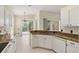 Eat-in kitchen featuring granite counters, stainless appliances and access to the screened lanai at 8412 Whispering Woods Ct, Lakewood Ranch, FL 34202