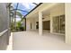 Spacious screened lanai with access to the home's interior and views of the tropical backyard at 8412 Whispering Woods Ct, Lakewood Ranch, FL 34202