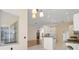 Open floor plan seamlessly connects the kitchen and living room, offering a spacious living area at 8412 Whispering Woods Ct, Lakewood Ranch, FL 34202