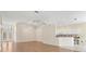 Open-concept living and dining area featuring wood floors and recessed lighting throughout at 8412 Whispering Woods Ct, Lakewood Ranch, FL 34202