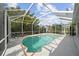 Inviting kidney-shaped pool with screened enclosure at 901 31St W Ave, Palmetto, FL 34221