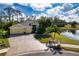 House with three-car garage and pond view at 9351 Raes Creek Pl, Palmetto, FL 34221