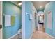 Bright hallway bathroom with toilet and linen storage, near the Primary bedroom at 9351 Raes Creek Pl, Palmetto, FL 34221