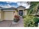 Inviting exterior of a single-story home with landscaped walkway at 9351 Raes Creek Pl, Palmetto, FL 34221